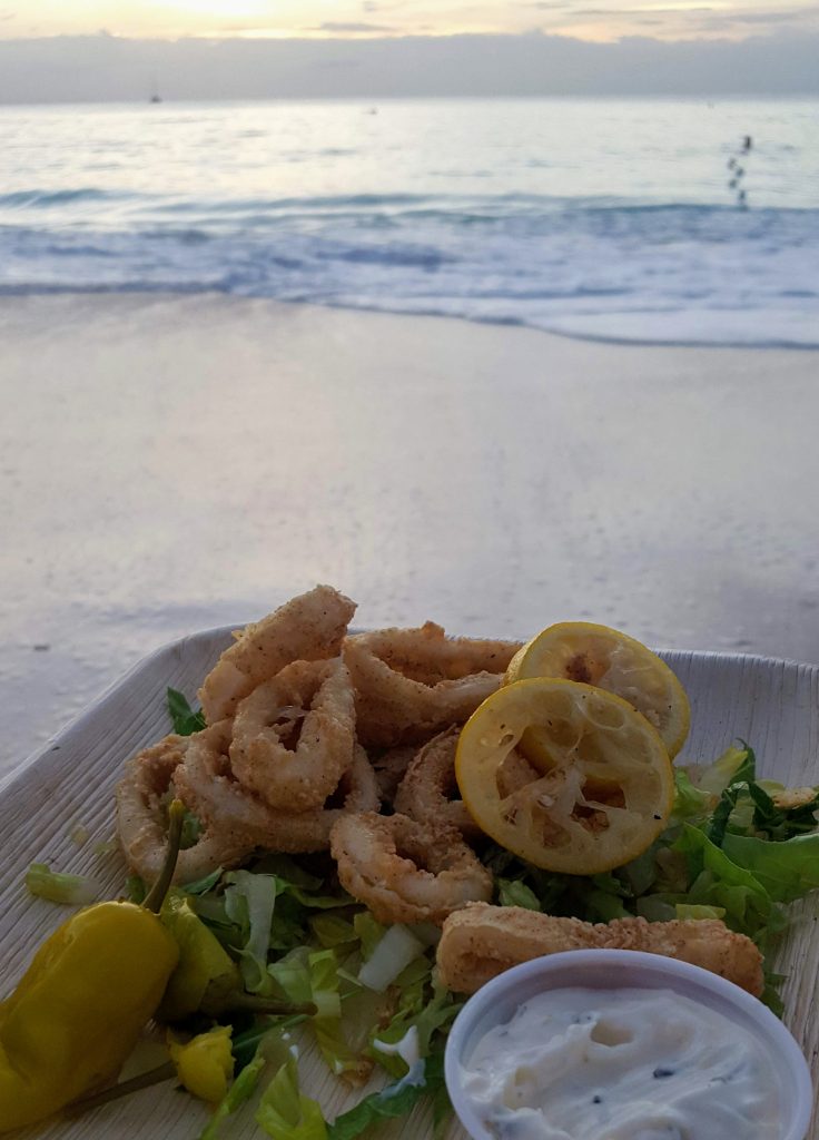 fried calamari on the beach watching the sunset