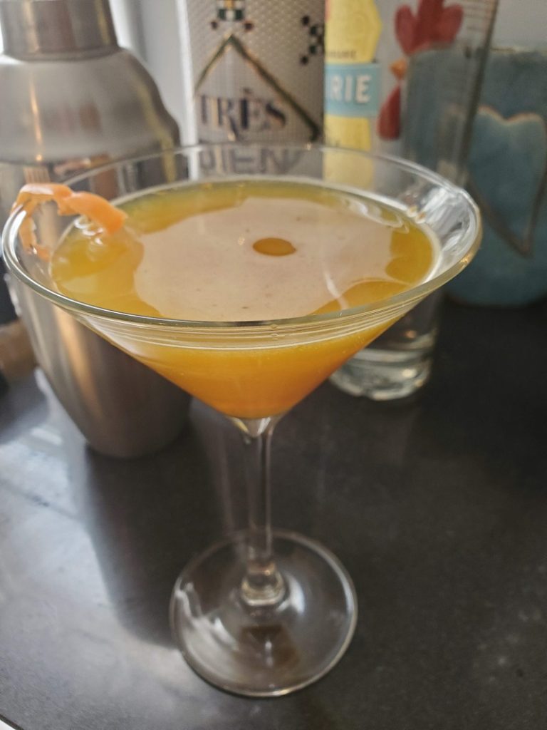 a spicy, healthy martini cocktail with habanero pepper garnish