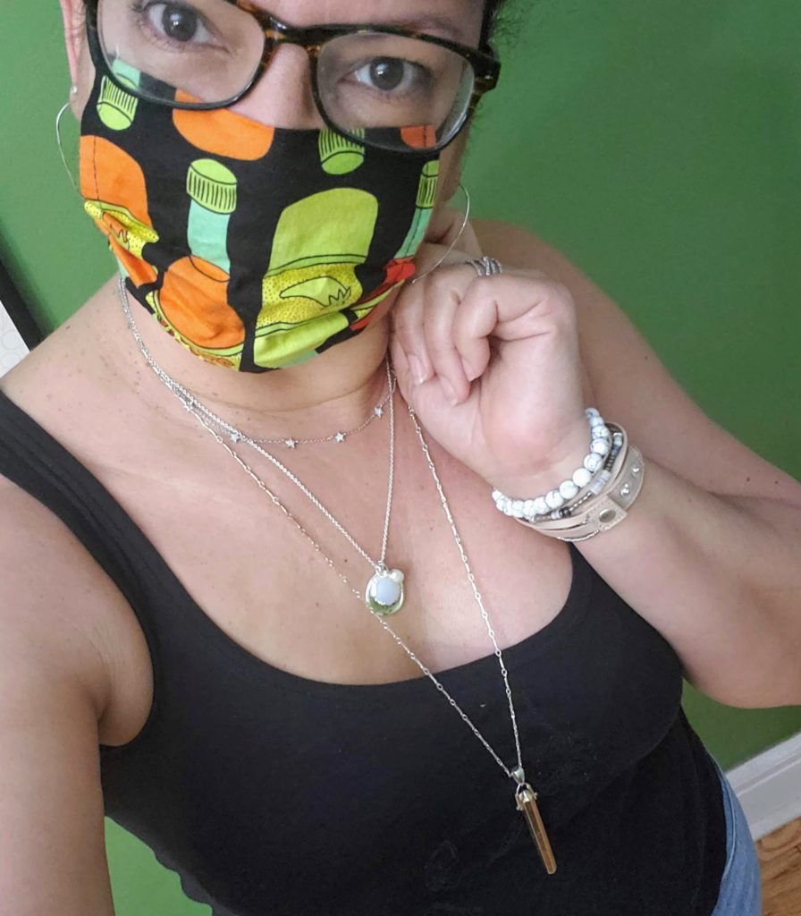 woman with protective hot sauce print mask