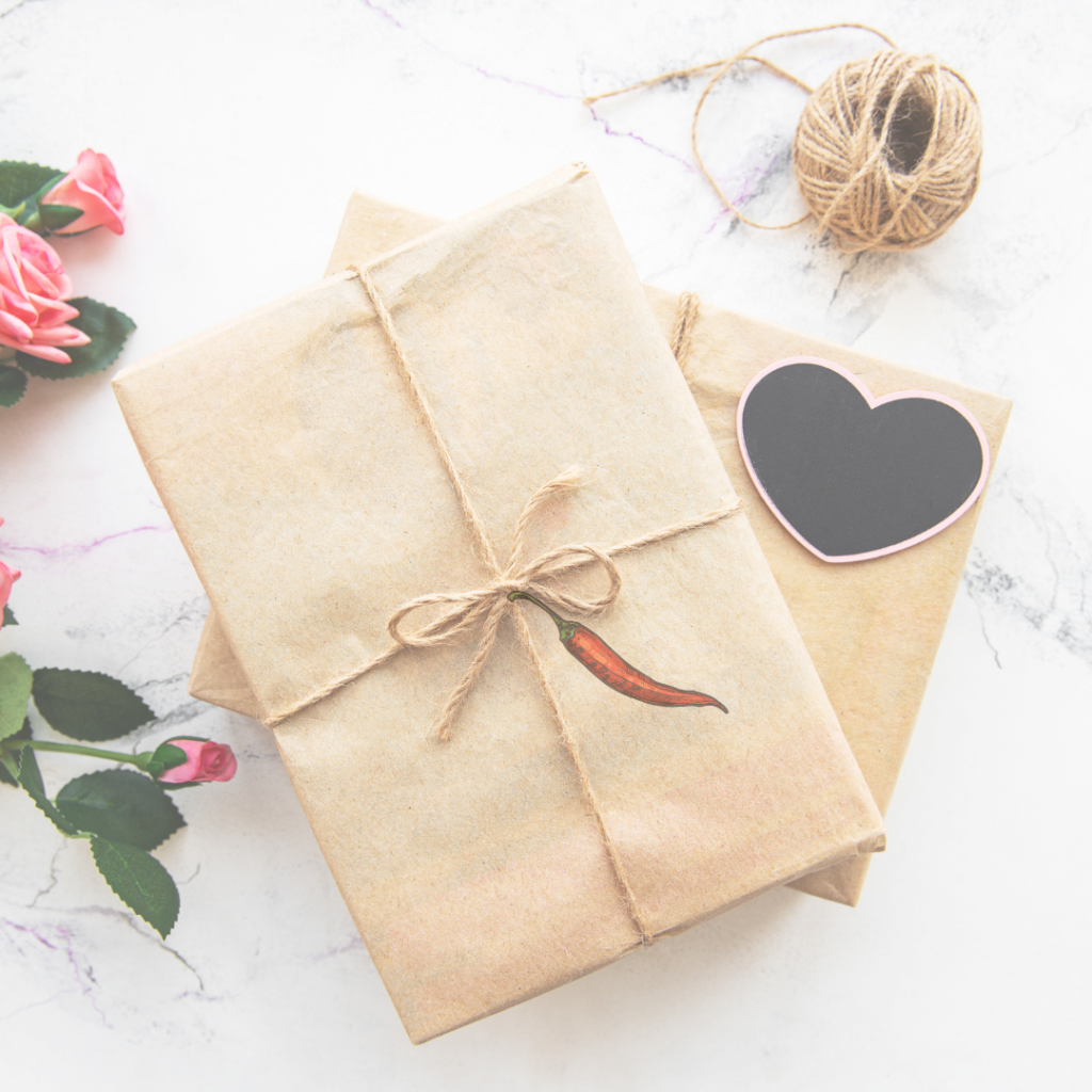 valentine's day boxes wrapped in craft paper with heart and chile pepper decoration